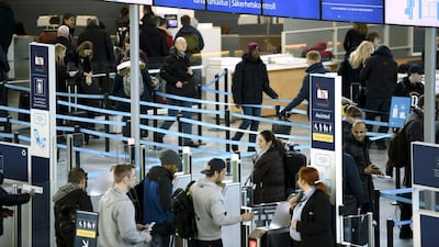 Passengers enter the security control area at Helsinki airport in Finland. Airports and airlines divide passengers along lines of wealth and passports – and few seem to mind these divisions. Lehtikuva/Antti Aimo-Koivisto/via Reuters