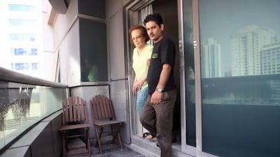 Vikram Singh and Garda Santos return to the scene of yesterday's rescue in the Tecom area's Art 4 building.