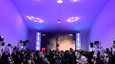 People attend a live screening of the launch of the UAE's first astronaut into space, at Mohammed bin Rashid Space Centre in Dubai. Chris Whiteoak / The National
