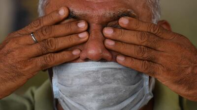 A man performs a yoga posture during a yoga class in Mumbai. AFP