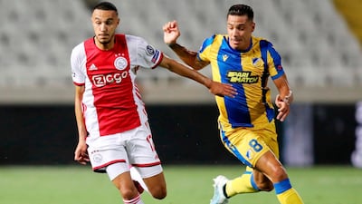 Ajax's Noussair Mazraoui is marked by APOEL's Lucas Souza. AFP