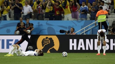 South Korea's Ki Sung-yueng, left, and Kim Bok-yung, right, react following their 1-0 defeat to Belgium at the 2014 World Cup on Thursday. Thanassis Stavrakis / AP