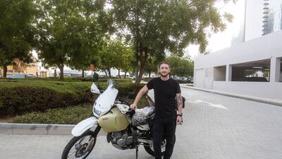 Evan Bourke with the bike he will be travelling on from Dubai to Ireland. Photo: Evan Bourke