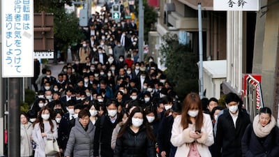 Commuters head to work in Tokyo, Japan. On average, people in Japan saved 44 per cent of their income in the five months through August this year. AP