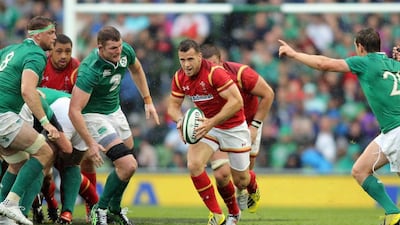 Gareth Davies, centre, leads the charge for Wales in their 16-10 win over Ireland at Dublin yesterday at Aviva Stadium. Paul Faith / AFP
