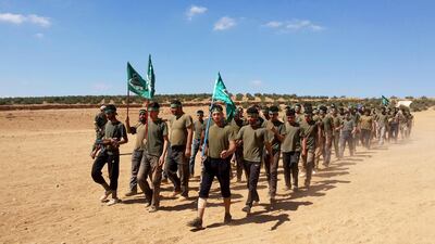 Col Nehmeh is unpopular even among supposed allies within the FSA, like the Yarmouk Brigade, above, who have long complained that his loyalties are to money and foreign intelligence agents, not the Syrian revolution. AFP / September 29, 2013