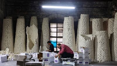 Workers pack bars of soap at a factory in the old city of Nablus in the occupied West Bank. AFP