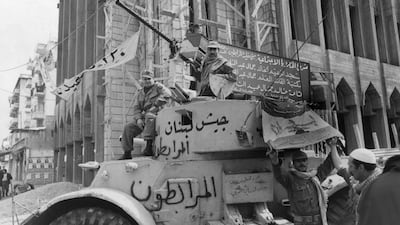 Guerrilla fighters on a tank in a street in Beirut during Lebanon's civil war, in December 1975. Getty Images