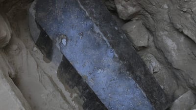 An undated handout photo made available by the Egyptian ministry of Antiquities shows the black granite sarcophagus at the discovered tomb in the Sidi Gaber district of Alexandria. EPA