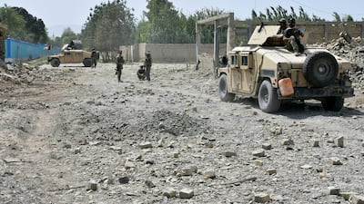 Afghan Security personnel inspect the site of truck suicide bombing in the northern Balkh province of Afghanistan.AP