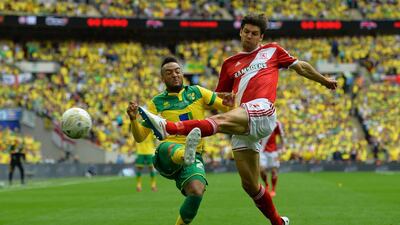 Norwich City’s English midfielder Nathan Redmond (L) vies with Middlesbrough’s English defender George Friend (R) during the English Championship play off final football match between Middlesbrough and Norwich City at Wembley Stadium in London on May 25, 2015. AFP PHOTO / GLYN KIRK