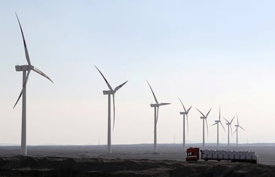 A truck moves past power-generating wind turbines on the outskirts of Cairo, Egypt, November 15, 2018. Reuters