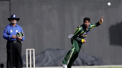 Pakistan’s Karamat Ali dismissed five Afghanistan batsmen in Sharjah on Thursday. He now has 16 wickets in the tournament. Satish Kumar / The National