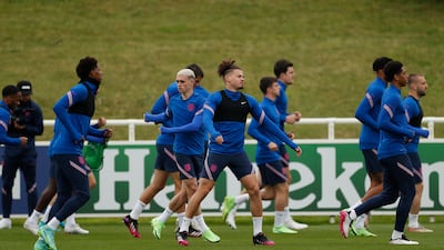 England players warm-up at training.