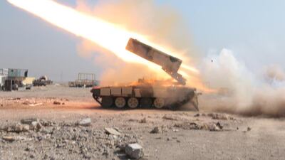 Iraqi forces fighting to retake Mosul airport from ISIL fire a missile from a rocket launcher on February 23, 2017. Florian Neuhof for The National