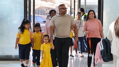 Parents accompany their young ones on the first day back to school