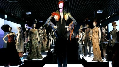 Dresses of the “Jungle Urbaine” collection are displayed during the exhibition devoted to French fashion designer Jean Paul Gaultier on March 30, 2015 in Paris. Patrick Kovarik / AFP photo
