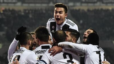 Juventus players celebrate after Cristiano Ronaldo scores a penalty. AFP