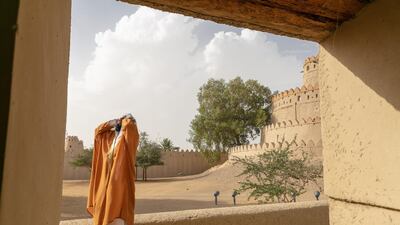An imam performs the call to prayer at the Jahili Mosque in Al Ain.