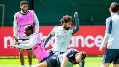 Liverpool players (L-R) Sadio Mane, Mohamed Salah, and James Milner perform during their team's training session at Melwood. EPA