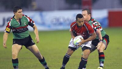Action from the Dubai Rugby Sevens match between Abu Dhabi Harlequins, in green, and the UAE Shaheen at The Sevens stadium in Dubai on November 30, 2012. Jake Badger for The National