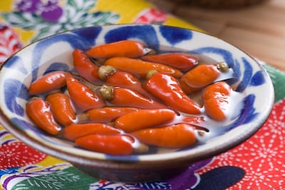 Koregusu chilies are infused in awamori rice spirit and added to Okinawa soba. Getty Images