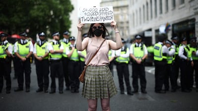Demonstrators hold up placards during a protest by Palestine Action supporters in London. AFP