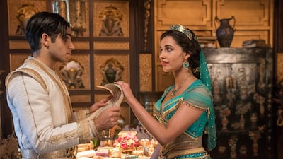 This image released by Disney shows Mena Massoud as Aladdin, left, and Naomi Scott as Jasmine in Disney's live-action adaptation of the 1992 animated classic "Aladdin." (Daniel Smith/Disney via AP)