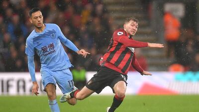 Dwight McNeil battles for possession with Jack Stacey during the Premier League match between Bournemouth and Burnley. Getty Images