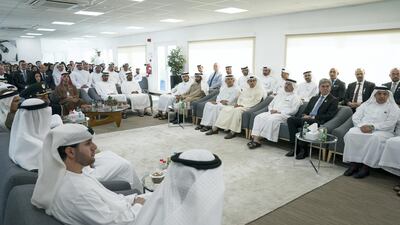 Sheikh Mohammed bin Zayed, Crown Prince of Abu Dhabi and Deputy Supreme Commander of the UAE Armed Forces (seated, centre 2nd R), listens to a presentation during a visit to the Expo 2020 main office in Jebel Ali. Omar Al Askar for The Crown Prince Court - Abu Dhabi