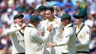Australia's Scott Boland, centre, celebrates with teammates after he clean bowled India's Shubman Gill. AP