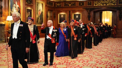 The Sultan of Oman, Sultan Haitham bin Tarik al Said, King Charles III, Queen Camilla and H.H. Sayyid Theyazin bin Haitham Al Said walk in procession to the state banquet as they view a display of items from the Royal Collection in the Green Drawing Room at Windsor Castle, Castle during the State Visit of the Sultan Of Oman to the UK, in Windsor, England. Sultan Haitham bin Tarik, Sultan of Oman, is on a three-day State Visit to the UK. Getty Images