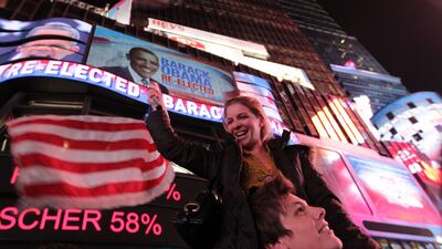 People celebrate in Times Square, New York, after it was announced that President Obama has been re-elected. Mehdi Taamallah / AFP