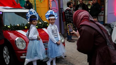 A family at the Christmas market. AP