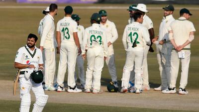 Pakistan's Azhar Ali walks back to the pavilion after his dismissal for 33. AFP