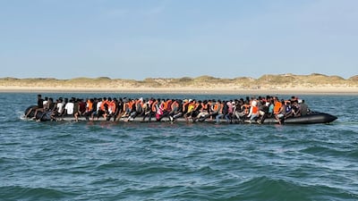 Migrants on board the 'mega dinghy' as it set off to cross the English Channel from France. AFP