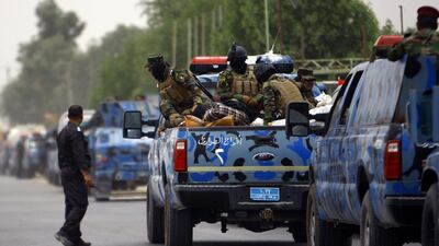 Iraqi police and army forces abandoned their posts in the northern city of Mosul after militants overran the provincial government headquarters and other key buildings. Haidar Hamdani / AFP Photo