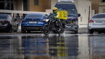 Water pooling along a street makes navigation tricky for motorists in the Al Quoz Industrial area of Dubai. Antonie Robertson/The National