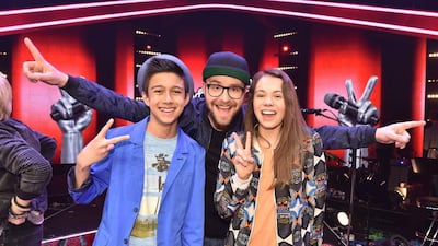 The Voice Kids Germany winner Lukas Janisch, left, with coach Mark Foster and Lara Blob. Andre Kowalski / SAT.1; AFP