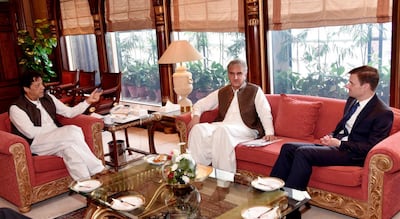 Outgoing US Ambassador in Pakistan David Hale, right, pays a farewell call on Prime Minister of Pakistan Imran Khan in Islamabad, Pakistan. AP