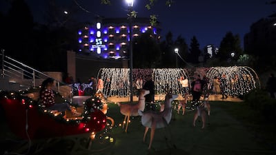 Palestinians visit the Christmas market in the West Bank city of Ramallah, marking the beginning of festive celebrations in the city