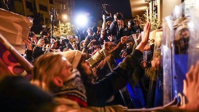 Protesters push against police shields as they try to march to Taksim Square. EPA