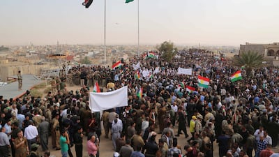 Iraqis wave Kurdish flags at a rally on September 19, 2017 in support of the upcoming independence referendum and against the parliament's sacking of the governor of oil-rich Kirkuk. Marwan Ibrahhim / AFP