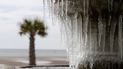 Icicles hang from the fountain in Biloxi, Mississippi. John Fitzhugh / The Sun Herald via AP
