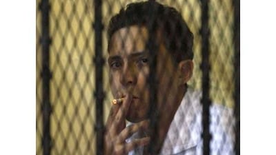 Mohsen el-Sokari sits inside the defendant's cage during his original trial. He was more animated during yesterday's testimony.