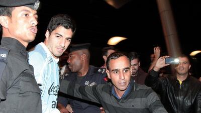 Luis Suarez arrives in Amman ahead of Wednesday's World Cup play-off between Uruguay and Jordan. Khalil Mazraawi / AFP