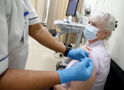 A woman receives a dose of the Pfizer-BioNTech Covid-19 vaccine at Zabeel Health Centre in Dubai on December 27. EPA