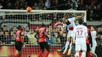 Alex heads in the equaliser for PSG on Saturday. Jean-Sebastien Evrard / AFP
