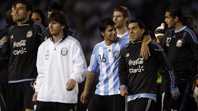 Carlos Tevez, second from right, has rejected reports of a rift between him and Argentina teammate Lionel Messi, second from left. They are pictured leaving the field at the end of a friendly against Canada in Buenos Aires on May 24, 2010. Natacha Pisarenko / AP Photo