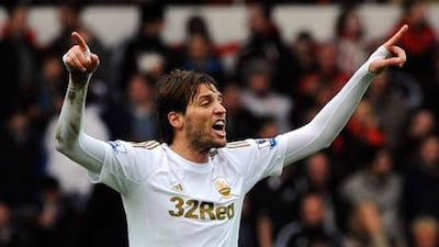 Swansea City forward Michu celebrates his goal against Manchester United.